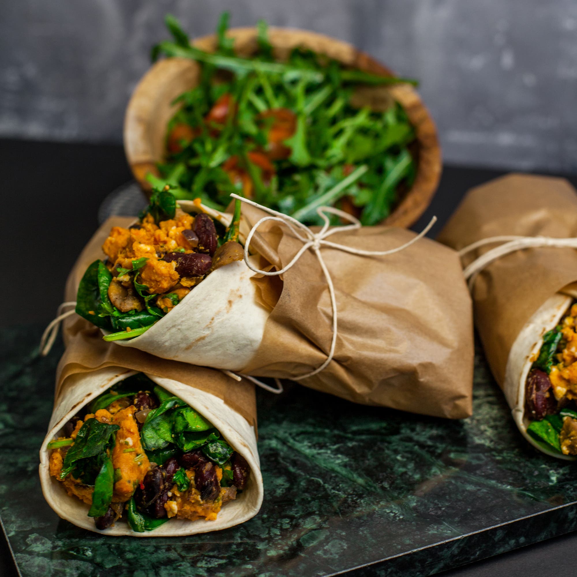 Sweet-potato wrap with feta cheese and spicy beans
